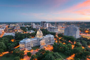 Aerial view of illuminated capitol building at dusk
