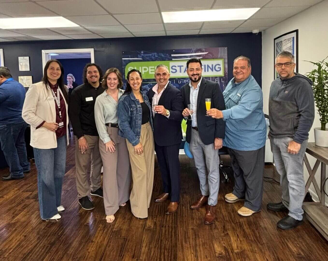 Smiling coworkers posing at office event